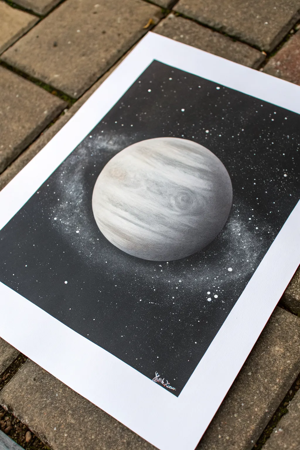 Stenciled planet with a soft airbrushed glow and a crisp masked ring on a dark space backdrop