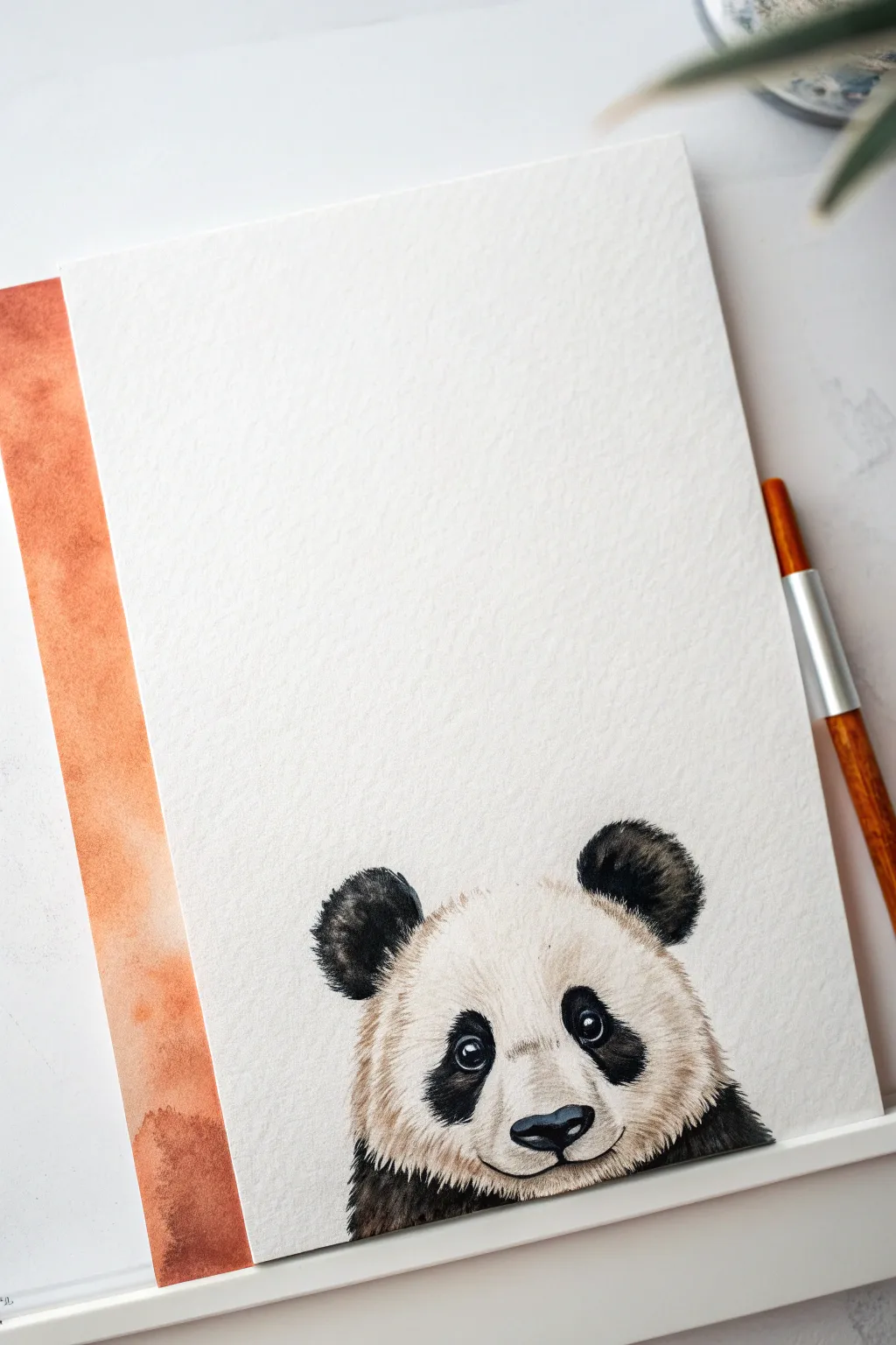 Simple peekaboo panda peeking over a painted line, perfect for an easy animal painting project.