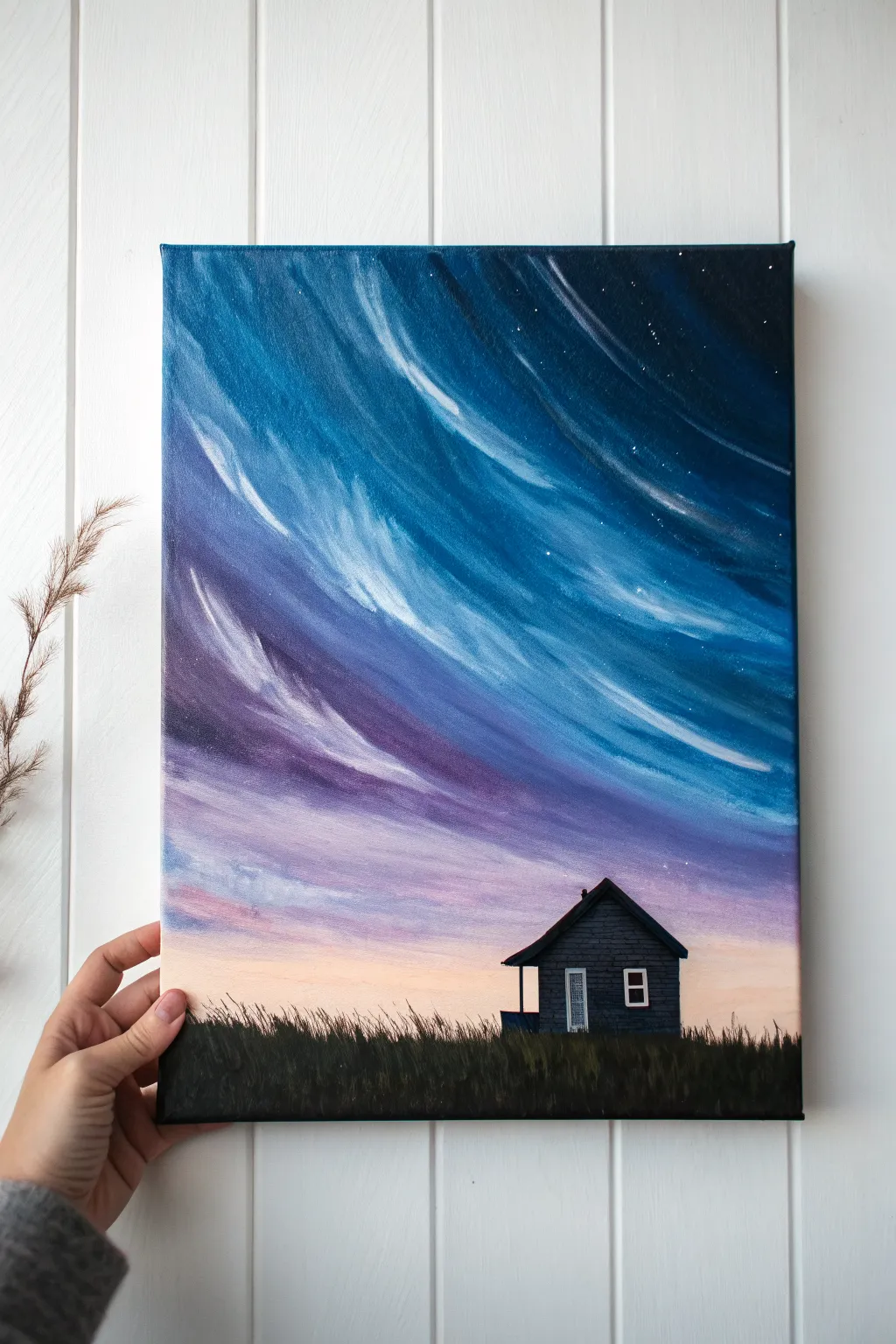 Swirly blues and purples crown a tiny house, a simple canvas idea with bold contrast and calm vibes