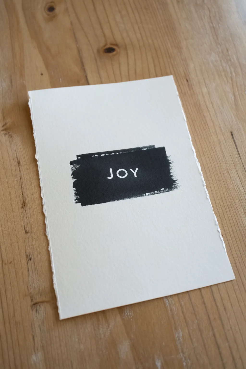 Bold negative space word art: a matte ink block with crisp unpainted letters to recreate.