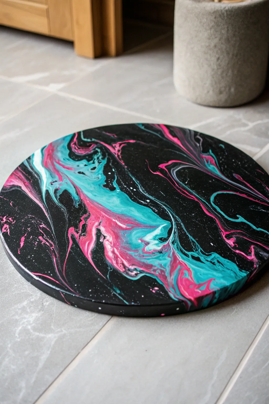 Watch vivid neon acrylics swirl on black for a stunning, high-contrast fluid art masterpiece.