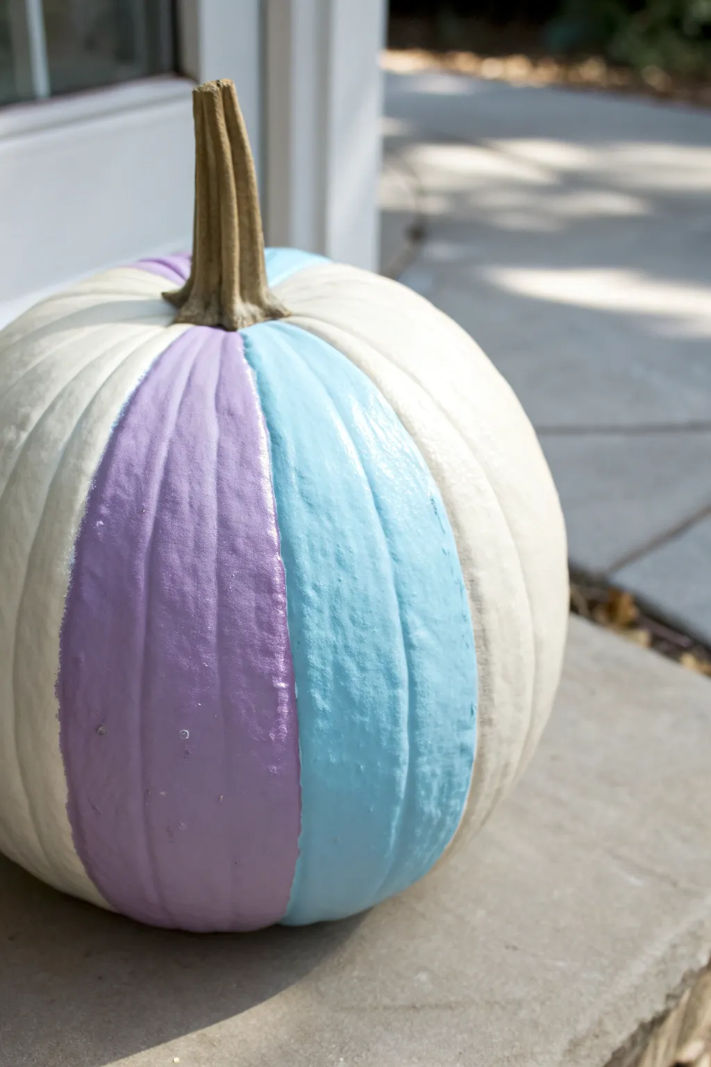 Color-block pastel pumpkin panels in lavender and pale blue for a preppy fall centerpiece