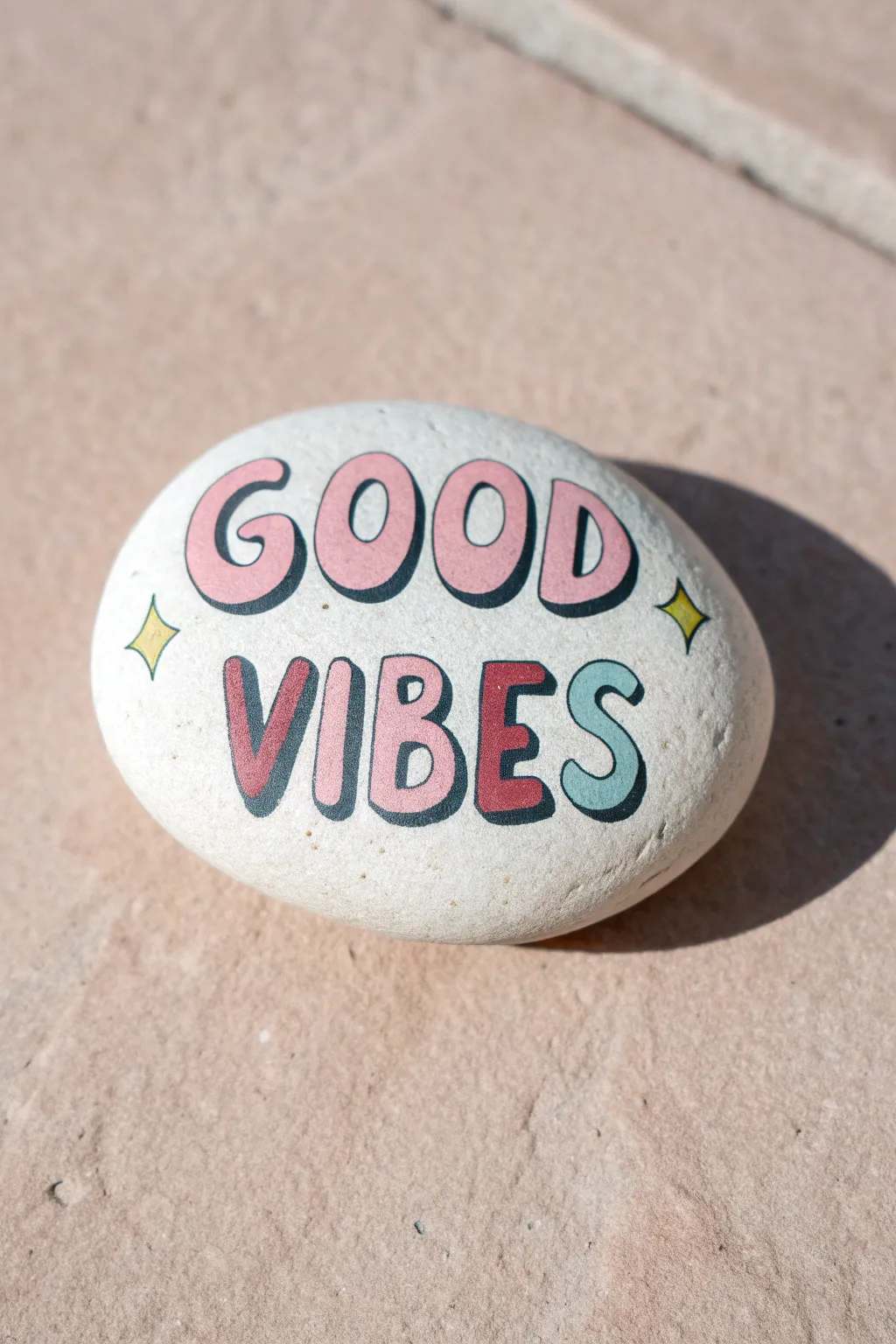 Pastel bubble-letter rock with crisp white outlines and soft shadows for instant good vibes.