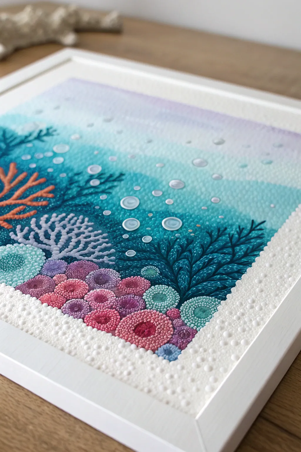 Underwater Q-tip dot art: clustered coral textures and airy bubble dots in teal, blue, and purple