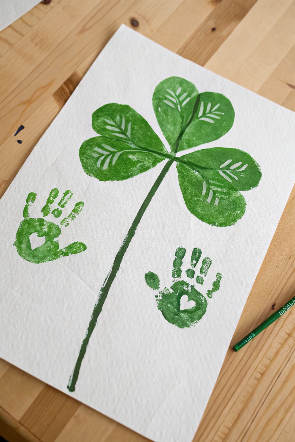 Create a sweet shamrock keepsake with three handprints, bright paint, and a simple stem