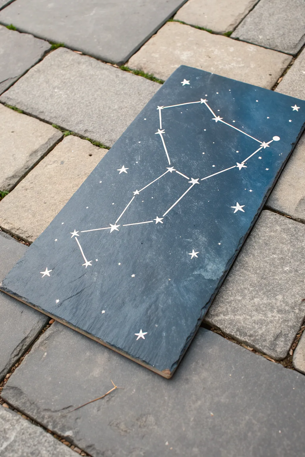 Minimal starry constellation on slate with a soft midnight-blue wash and crisp white stars.