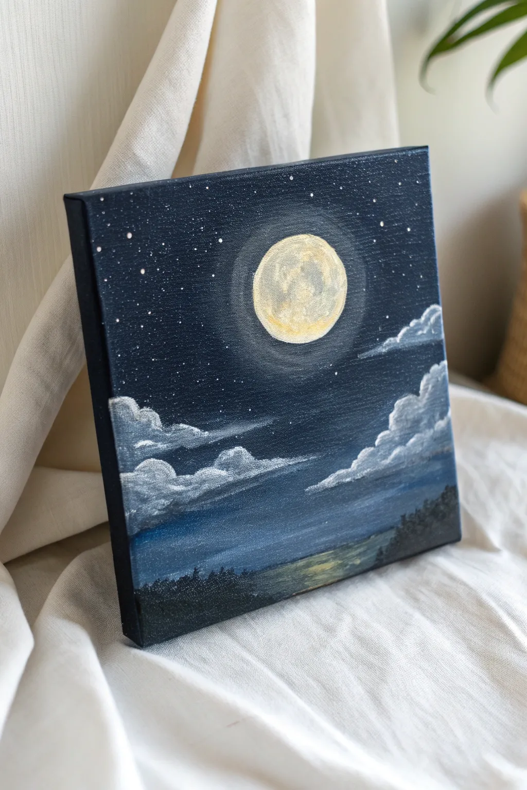 Moonlit night sky study on a tiny canvas, deep nocturne blues with a soft glowing moon