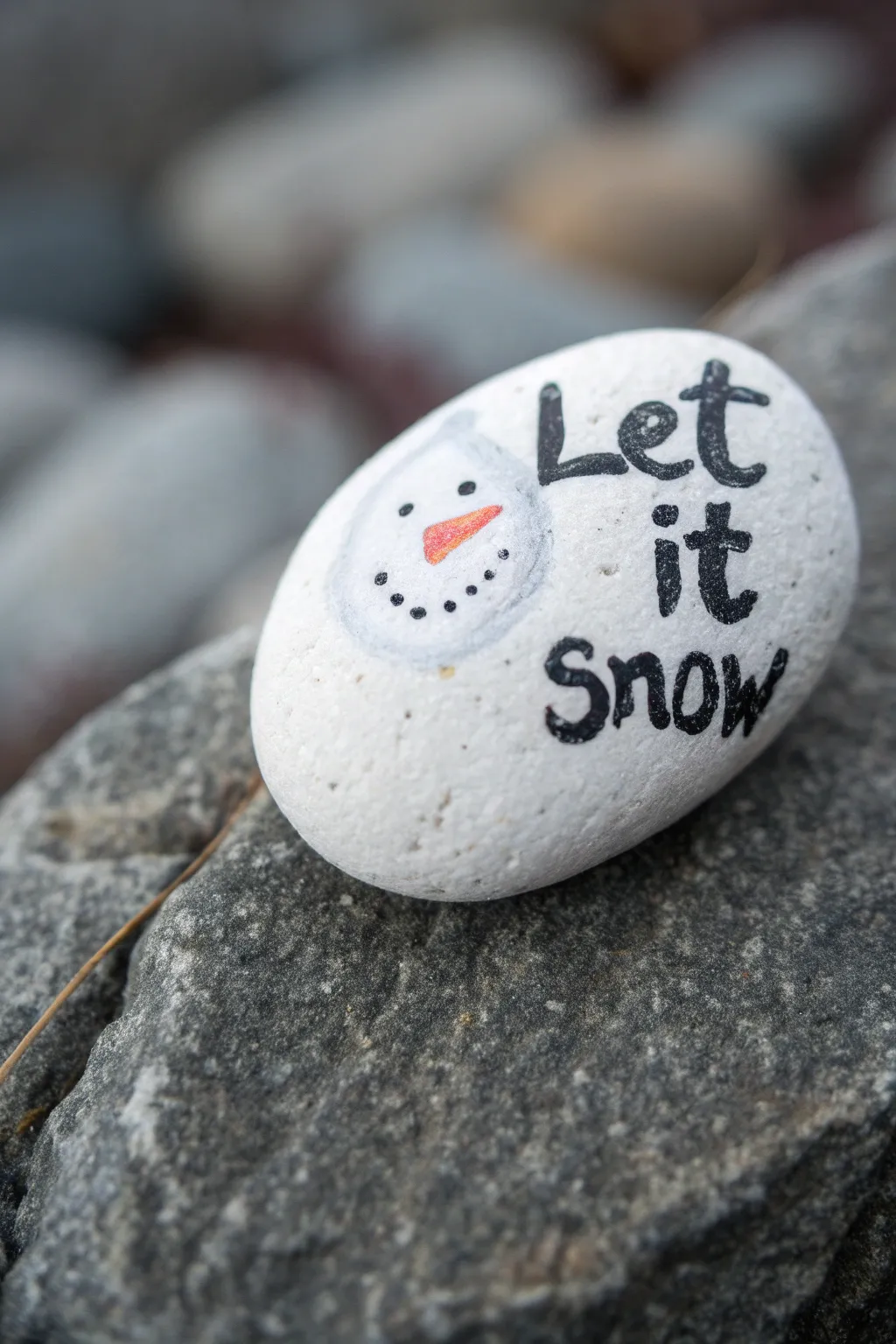 Cozy minimalist snowman rock with hand lettering and delicate snowflakes, Pinterest-ready.