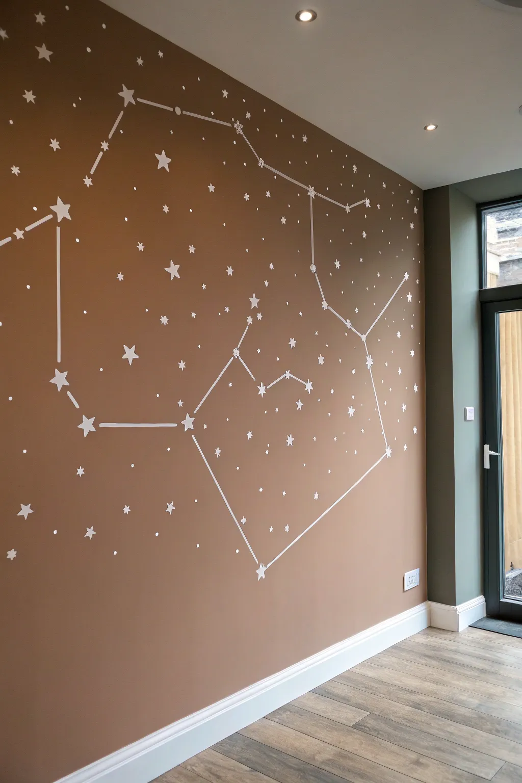 Minimal constellation wall drawing with tiny star dots and delicate lines in warm dusk light