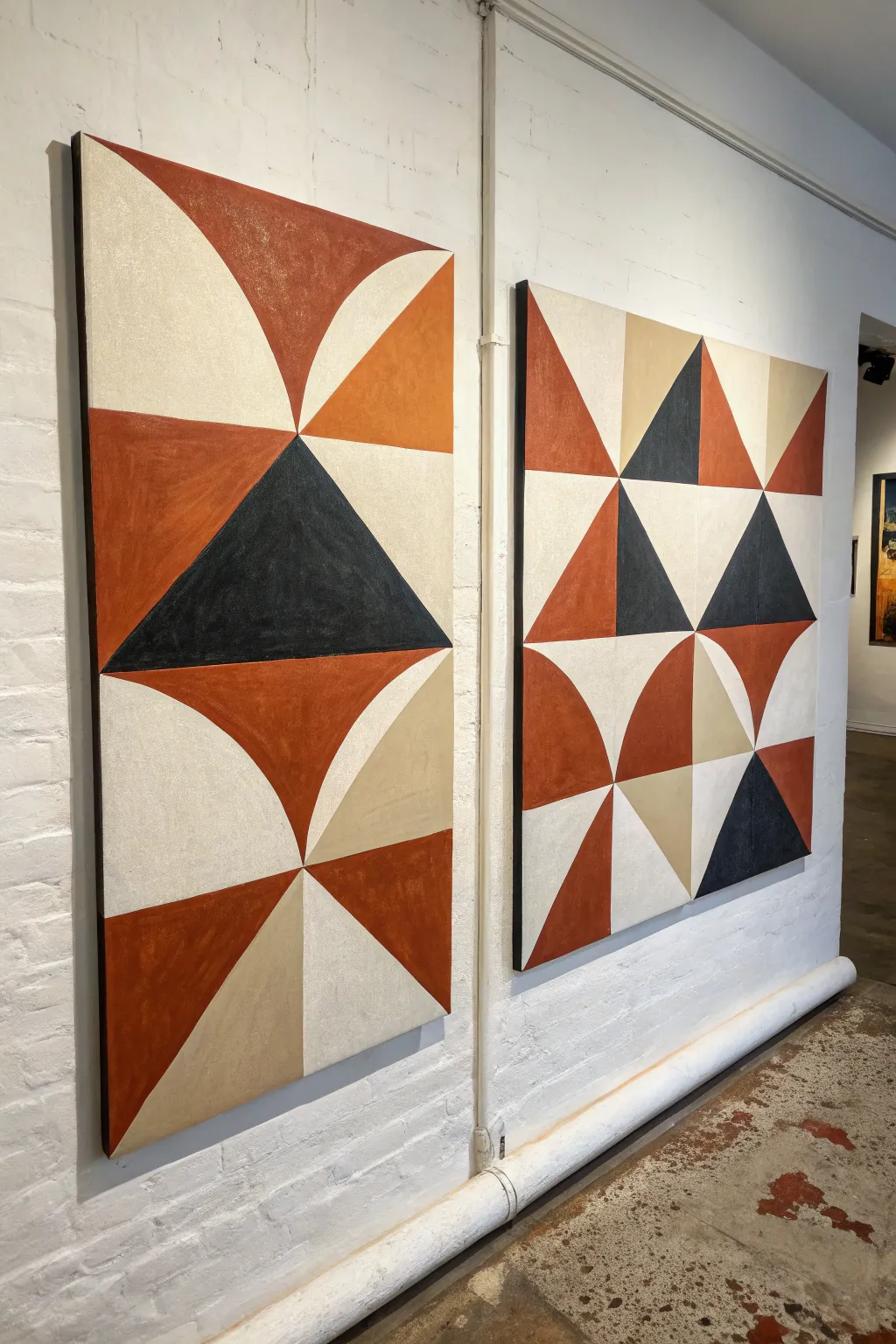 A minimalist diptych where bold triangles and arcs complete the pattern only when paired.