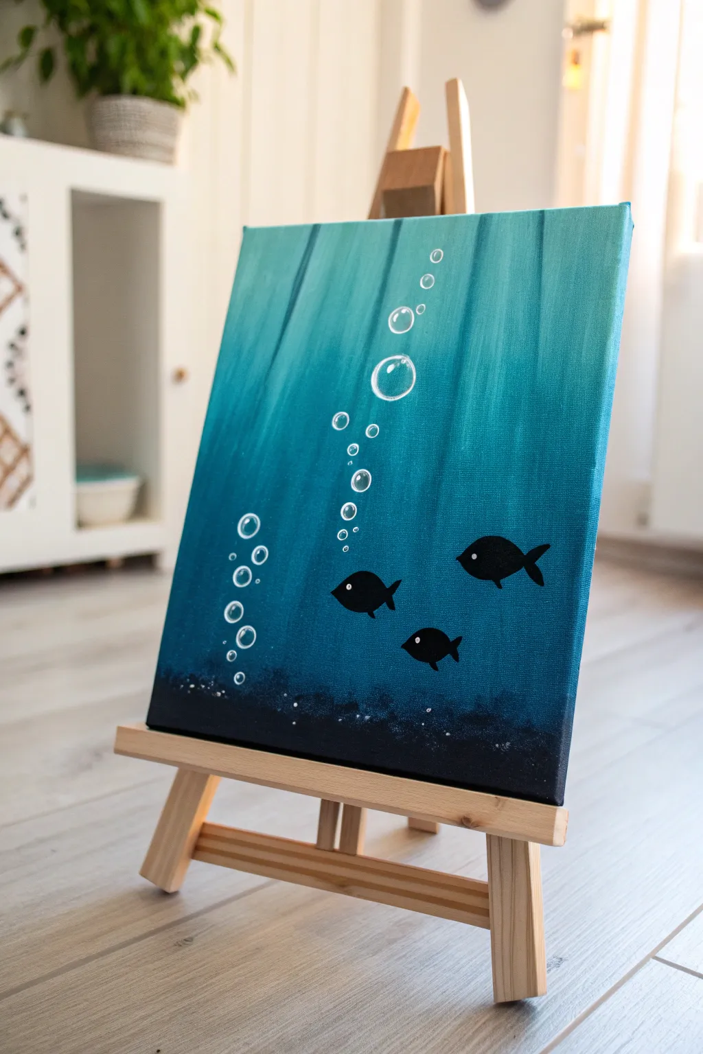 Simple underwater acrylic: teal gradient, fish silhouettes, bubbles, and soft light rays