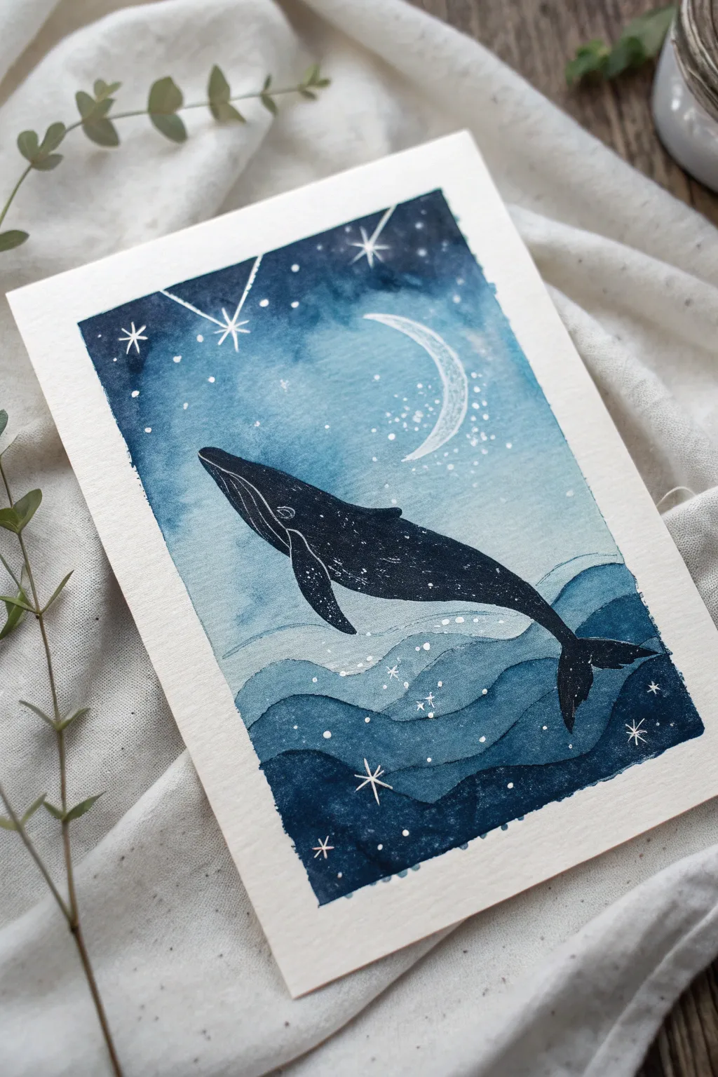 Dreamy watercolor whale silhouette drifting between midnight sea and starry sky, serene