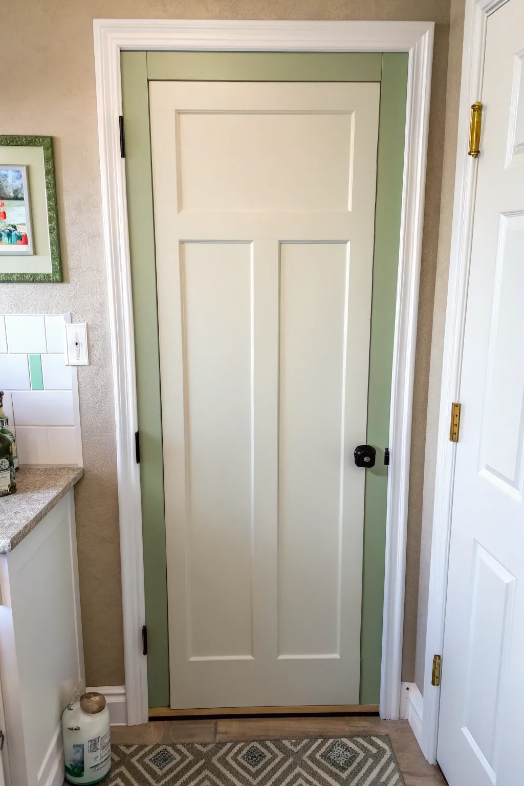 An inset-frame paint border adds instant architectural detail to a plain bathroom door.