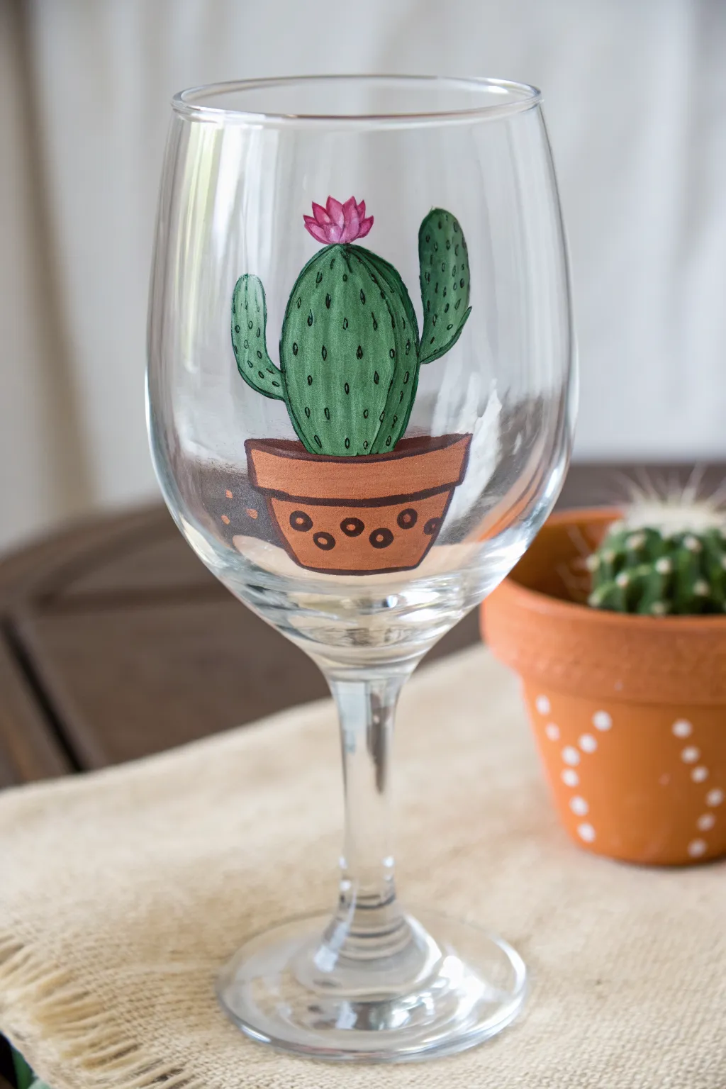 Beginner-friendly cactus wine glass design, minimal boho vibes with clean contrast.