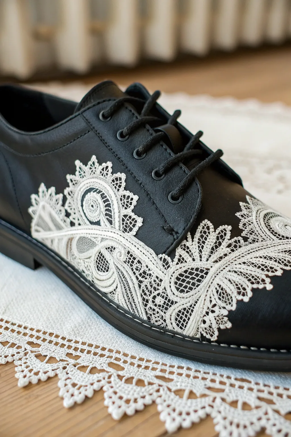 Matte black shoe panel with crisp white lace illusion paint, minimal backdrop and side light.