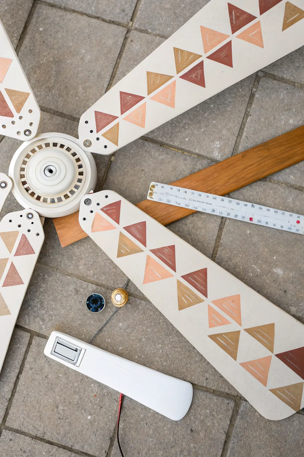 Modern ceiling fan blade makeover with crisp triangle pattern in neutrals and a terracotta pop