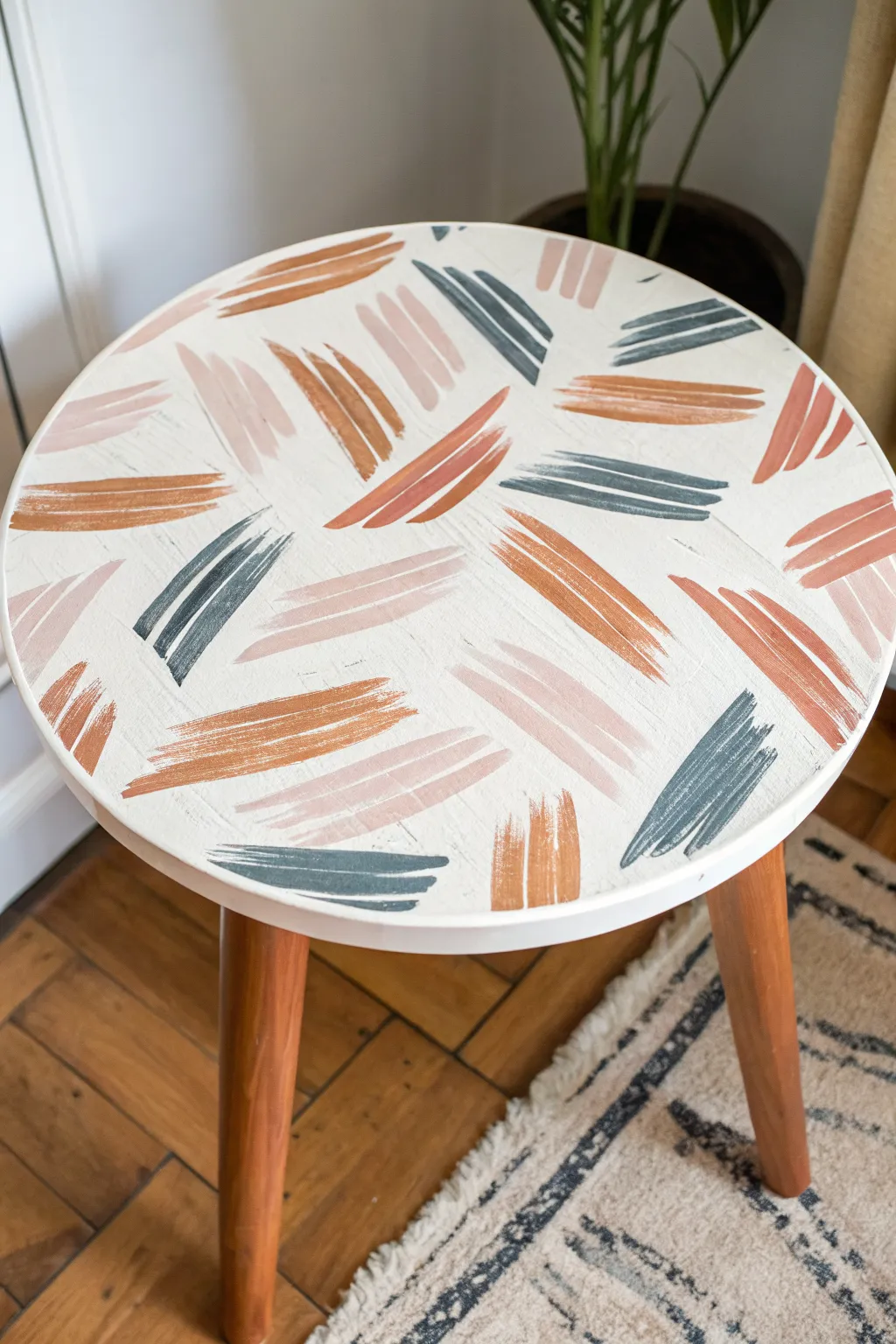 Loose abstract brushstrokes turn a simple tabletop into a bold, modern DIY statement piece