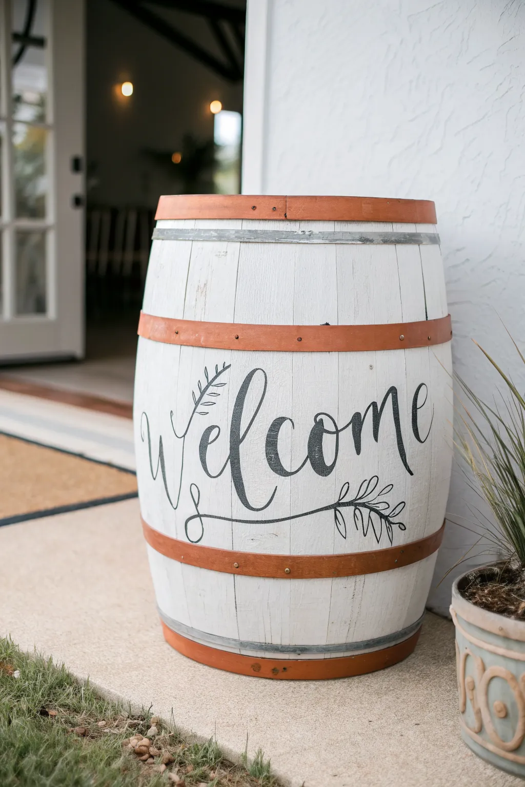 Minimal painted barrel with hand-lettering style details, a tidy entryway accent with contrast