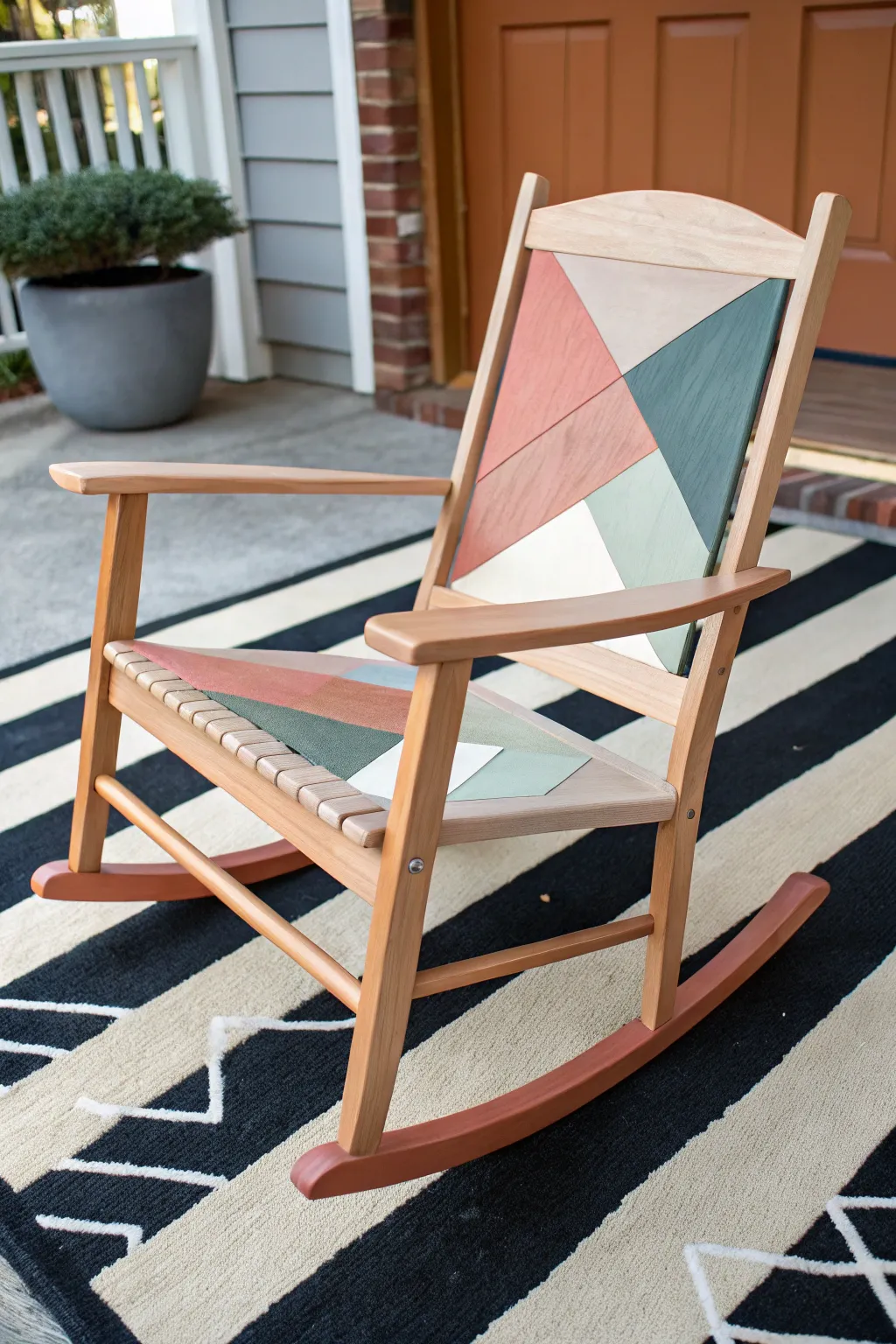 Geometric color blocks give this DIY painted rocking chair a bold, minimalist Scandinavian vibe
