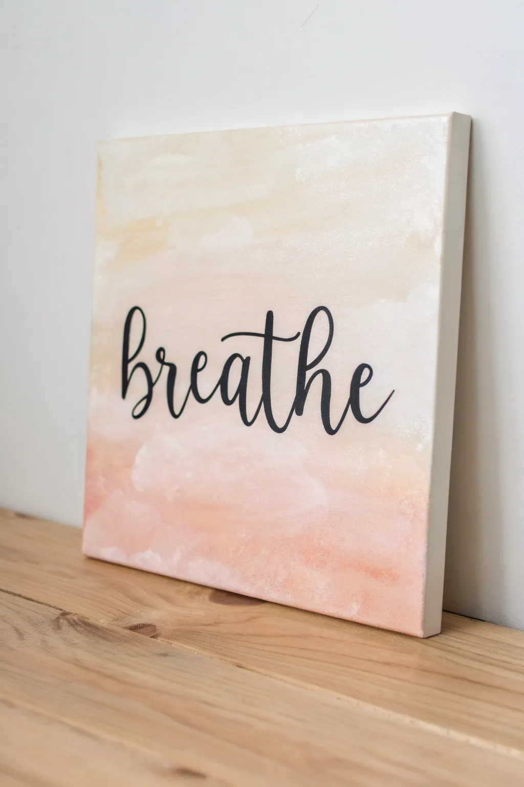 Soft painted wash canvas with one bold hand-lettered word, minimalist Scandinavian boho vibe