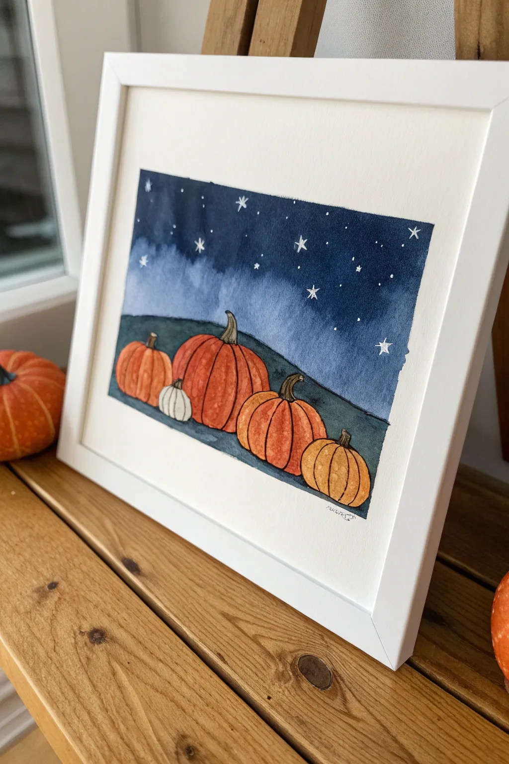 Easy oval pumpkins under a starry night sky, a cozy high-contrast Halloween painting for kids