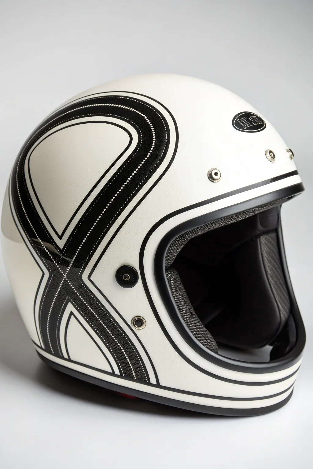Bold black wrap pattern on a matte helmet, clean Scandinavian minimalism with striking contrast