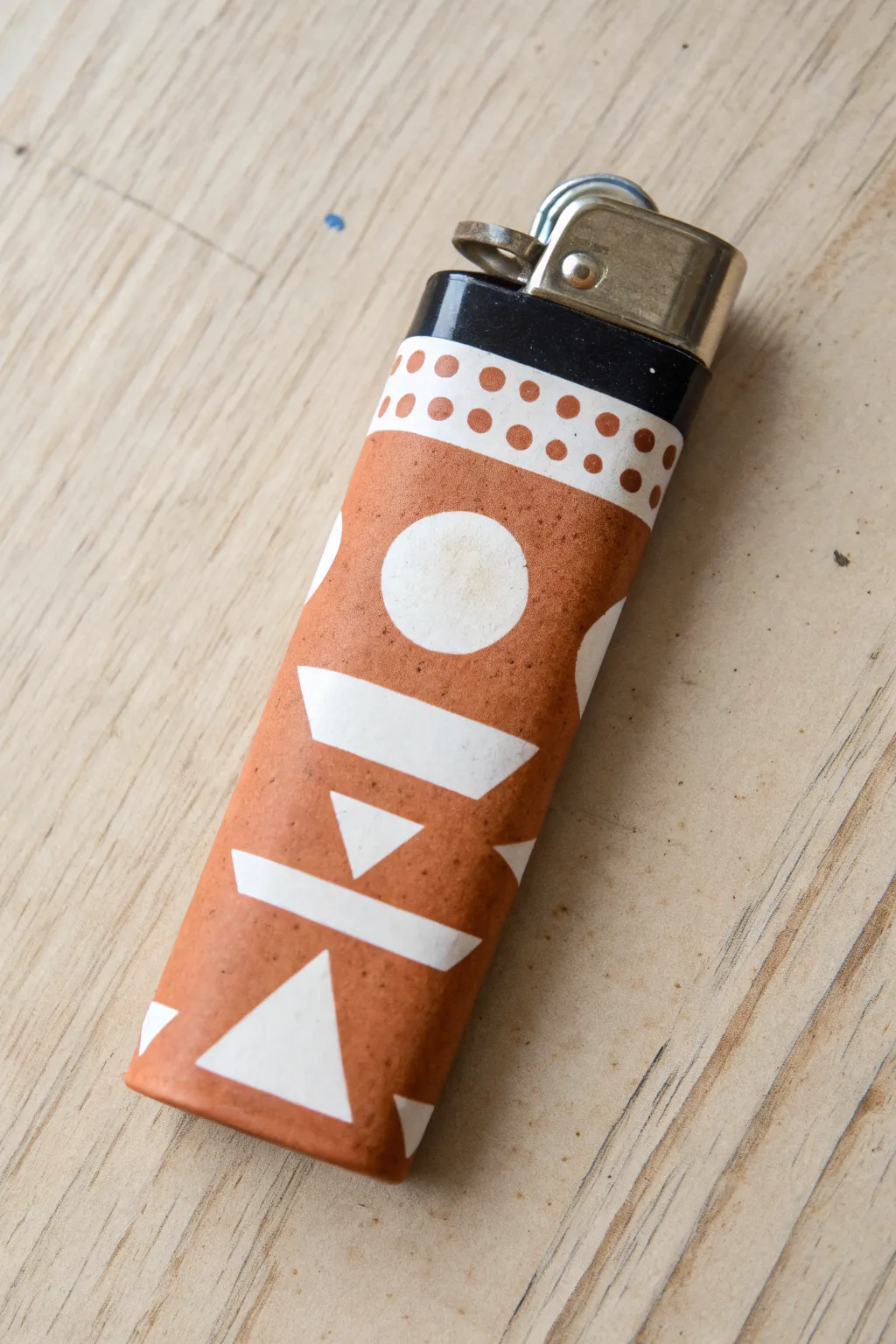 Layered stencil shapes on a painted lighter for clean, crisp edges and modern boho style.