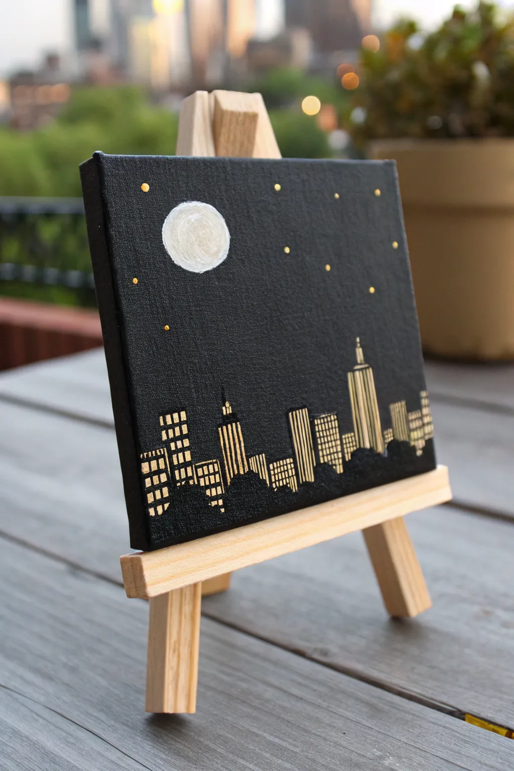 Mini black canvas night skyline with warm window lights and a bright moon for cozy city vibes.