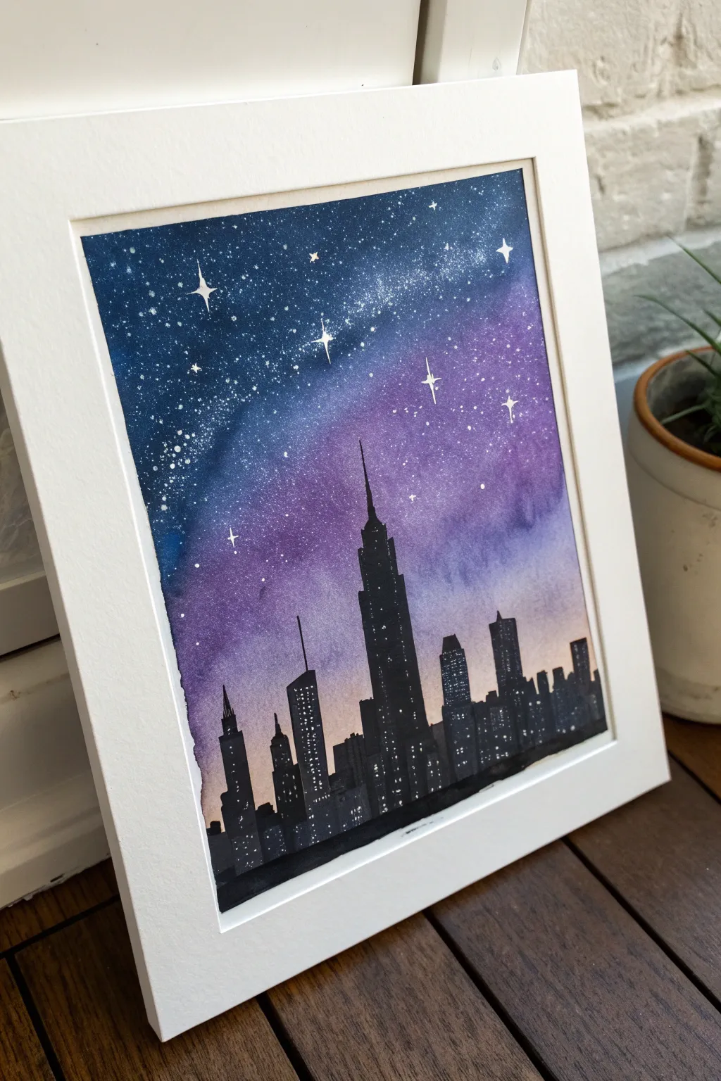 Minimalist skyline silhouette beneath a starry gradient sky, a striking night painting idea