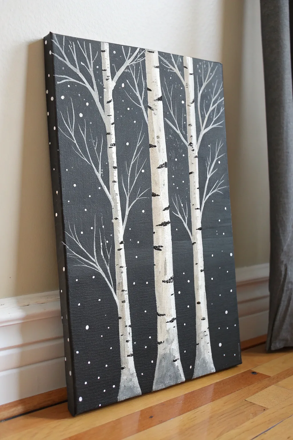 Easy black background birch tree painting idea with snowy splatter for a calm winter night mood