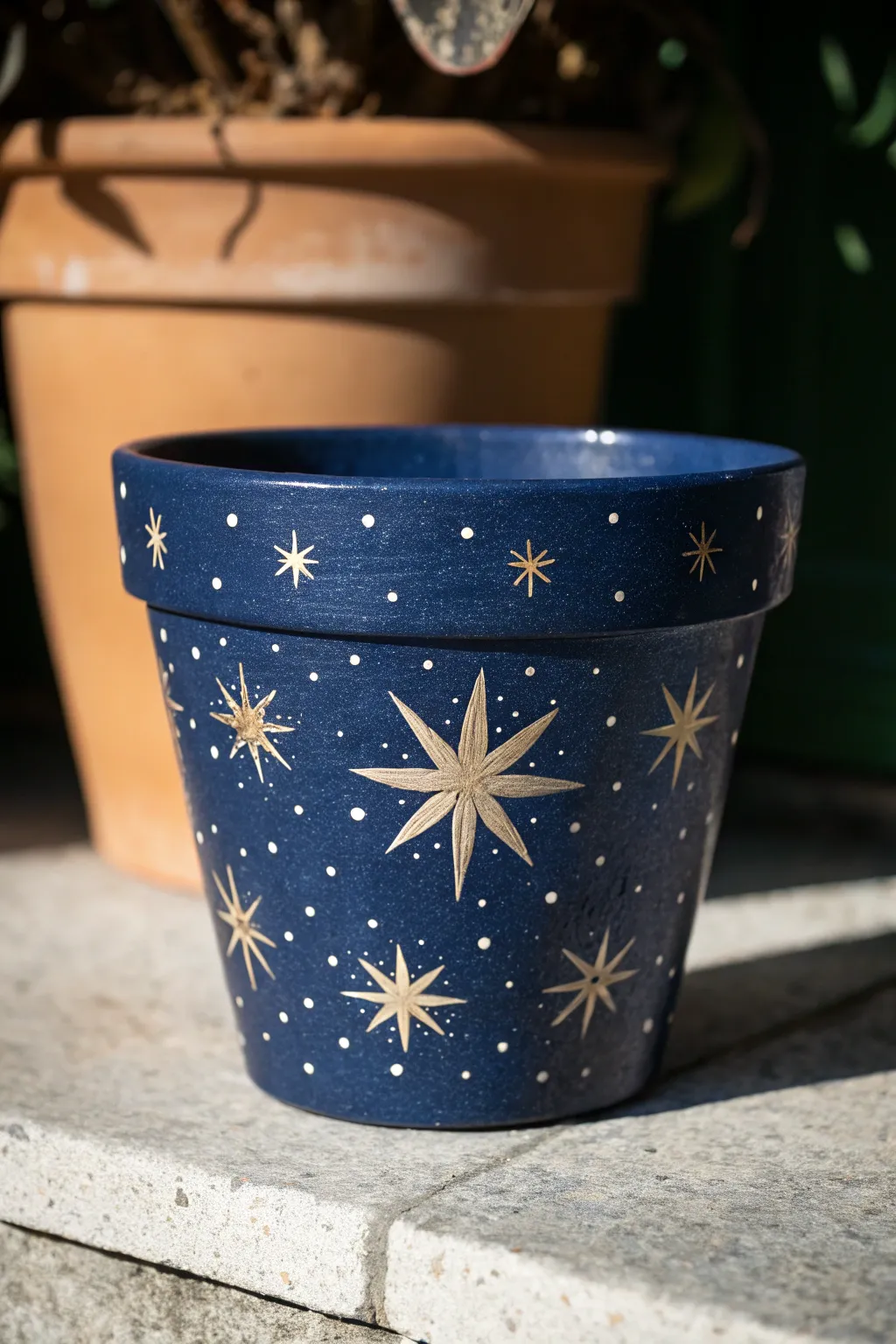 Paint a celestial night sky pot with starbursts and constellations for cozy minimalist decor