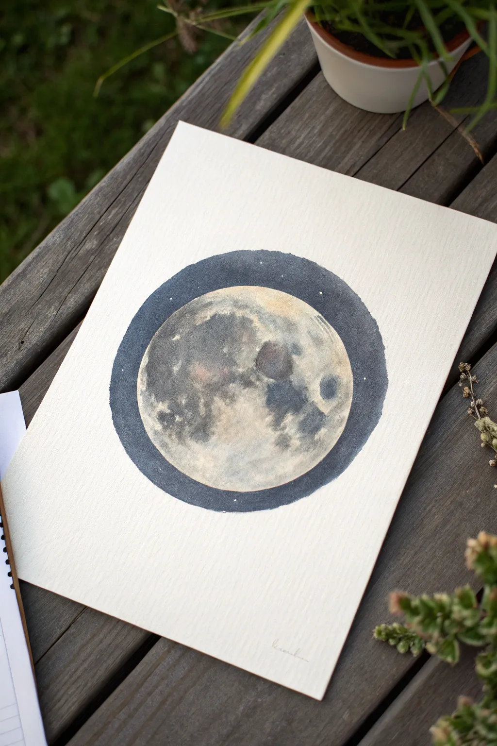 Paint a realistic full moon with gentle crater shading and a soft glow on a deep night sky.