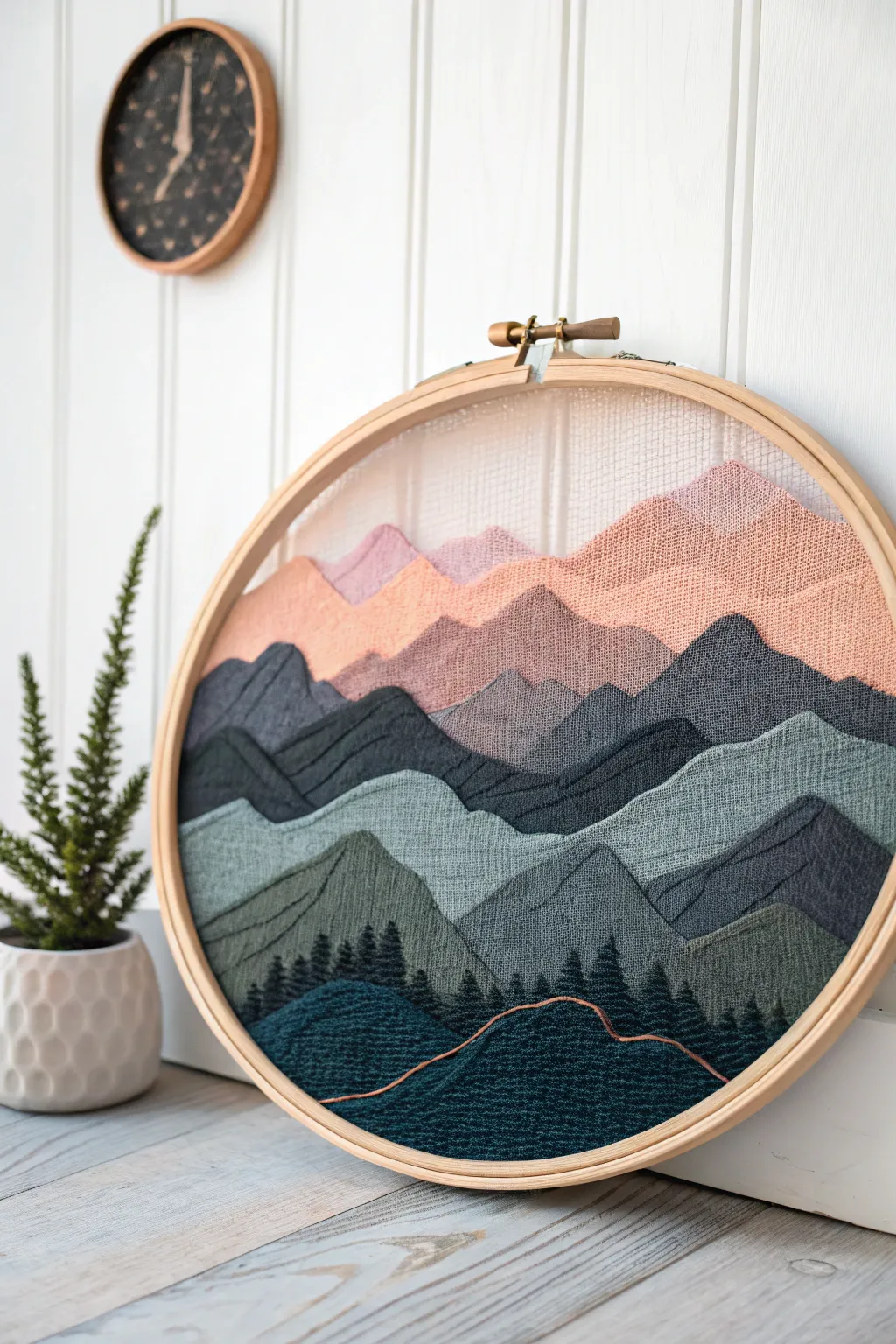 Sunset gradient mountains painted on wire mesh for a clean, airy screen painting idea