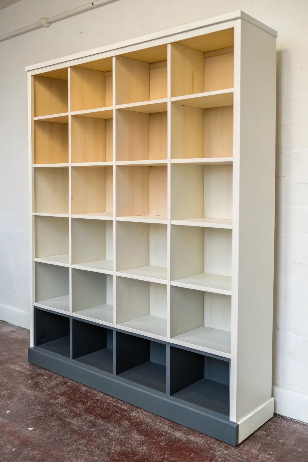 Ombre shelves fading from creamy white to deep charcoal for a modern Scandinavian boho vibe