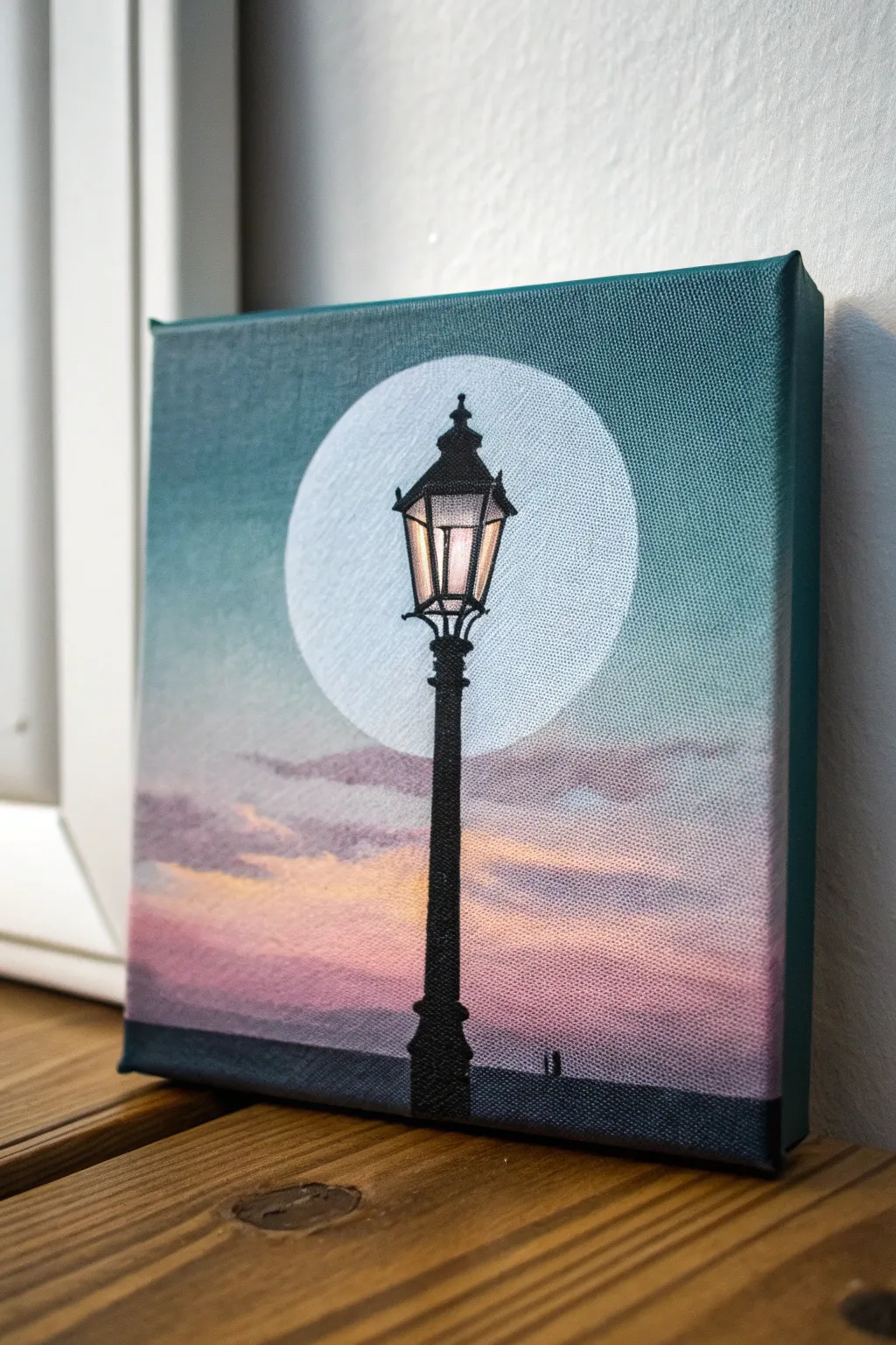 Minimal dusk streetlight silhouette with a soft halo glow, perfect small acrylic study.
