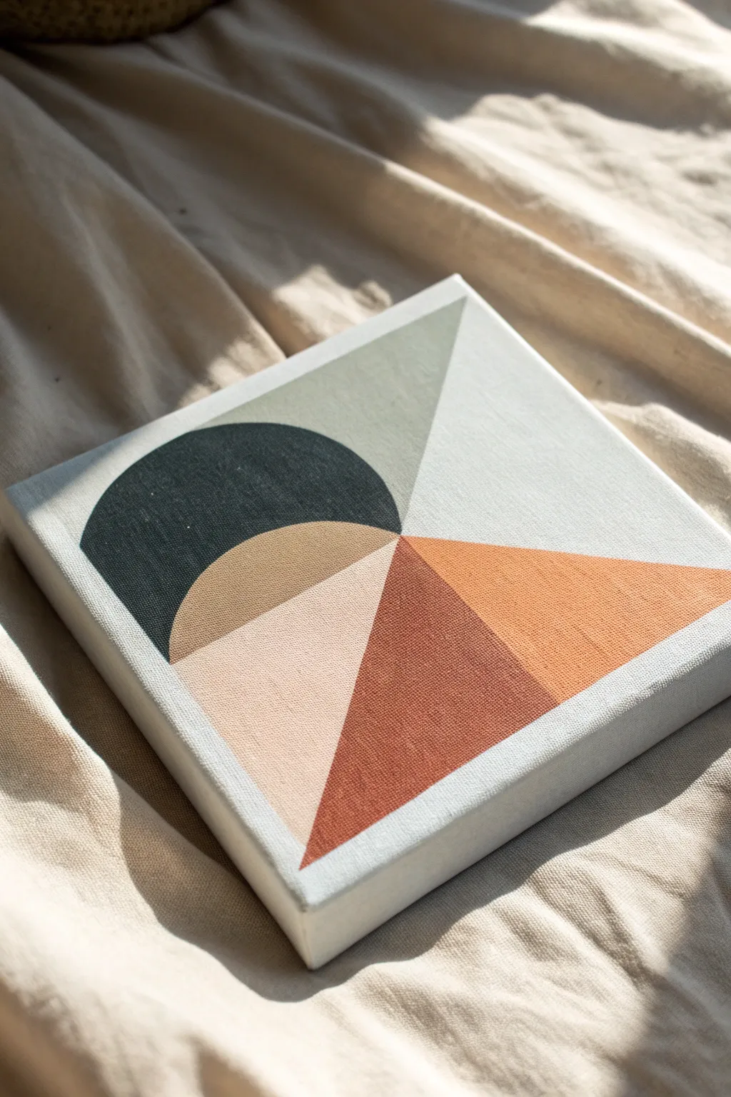 Modern geometric color blocks on a small canvas, Scandinavian minimalism with warm boho tones.
