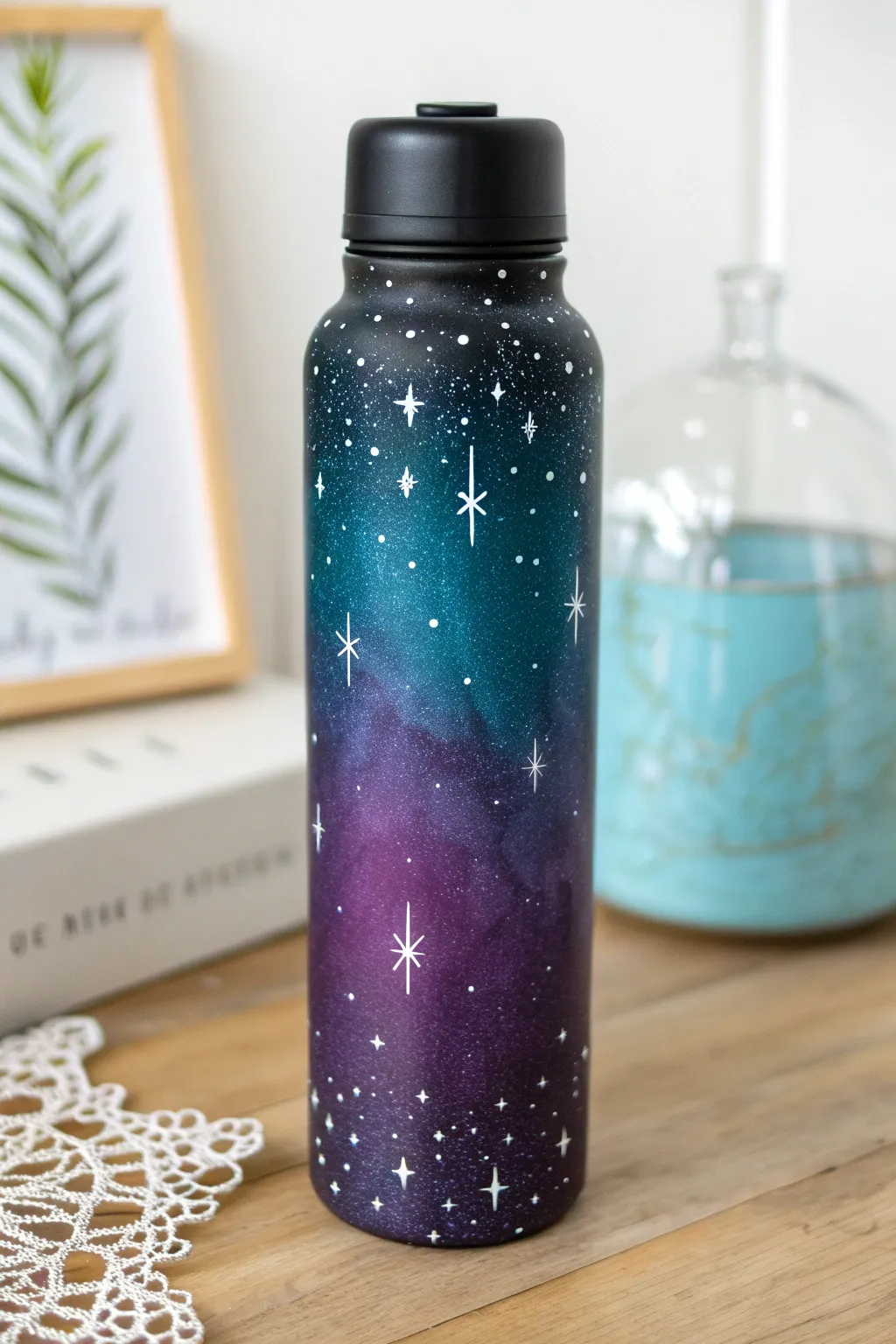 Night sky galaxy splash on a painted water bottle with delicate stars and dreamy glow details