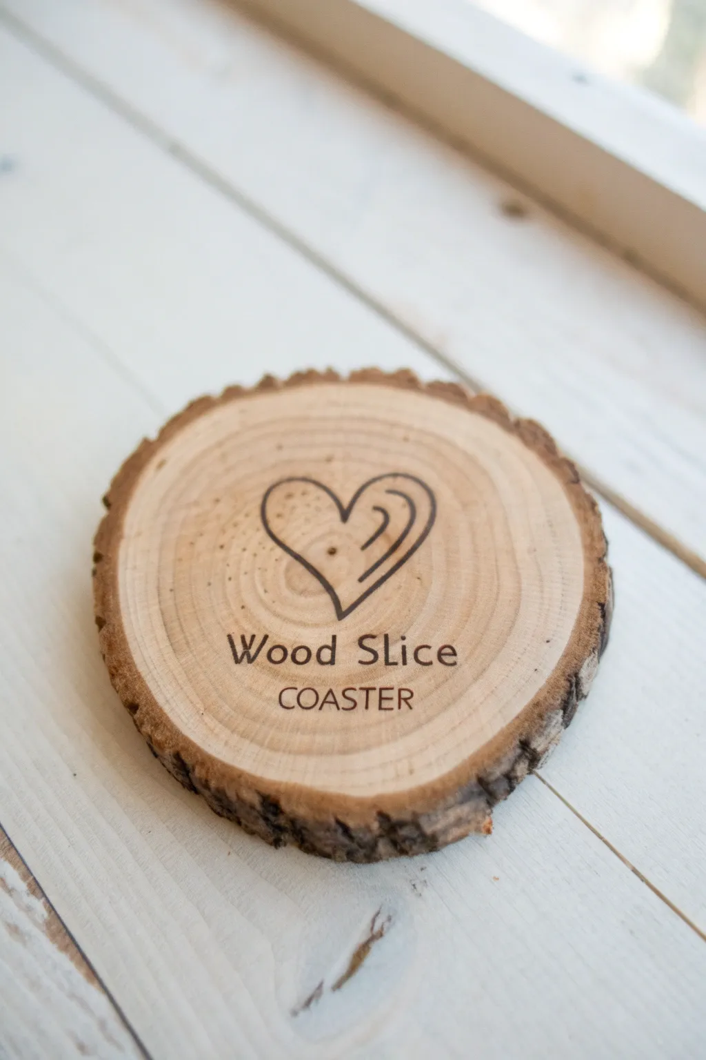 Sketch a carved-look heart and initials on a wood slice for a sweet rustic keepsake