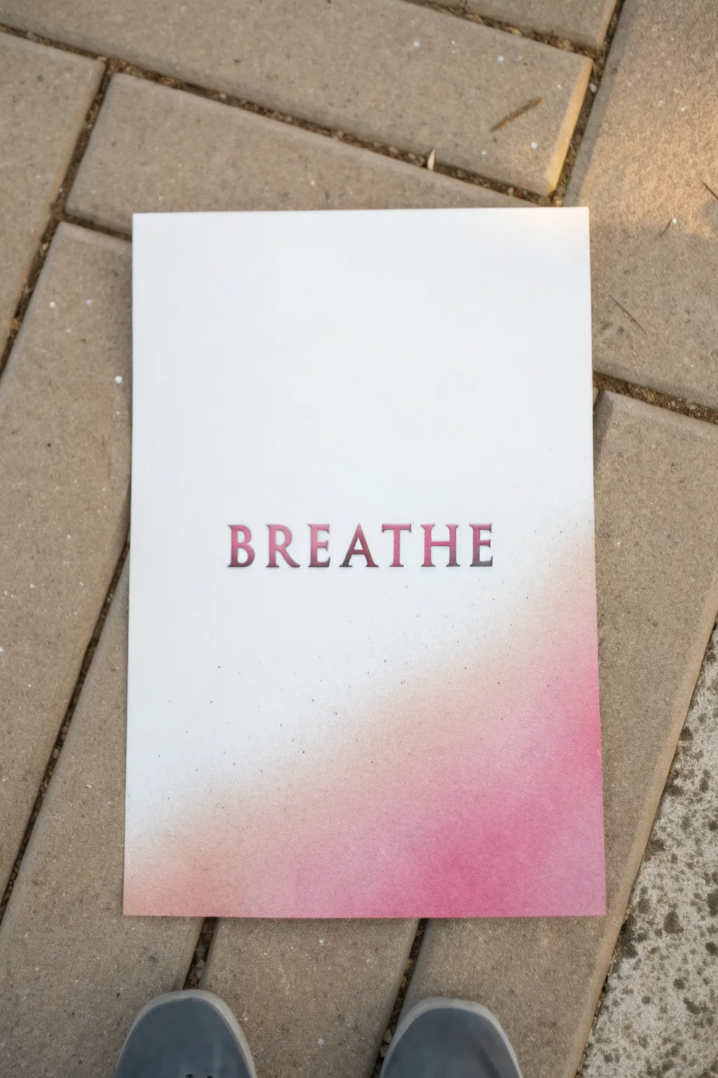 Negative space stencil lettering with a crisp word and a soft spray paint gradient for beginners