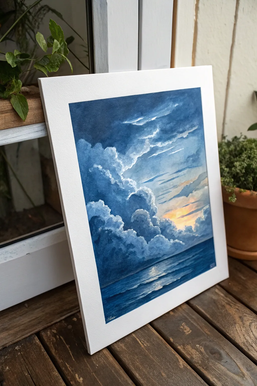 Layered gray blue storm clouds on a bold blue background with one sunlit break in the sky