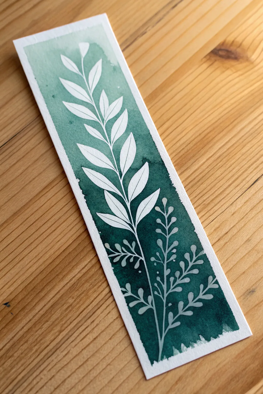 Master the art of negative space with this bold and simple botanical bookmark idea.