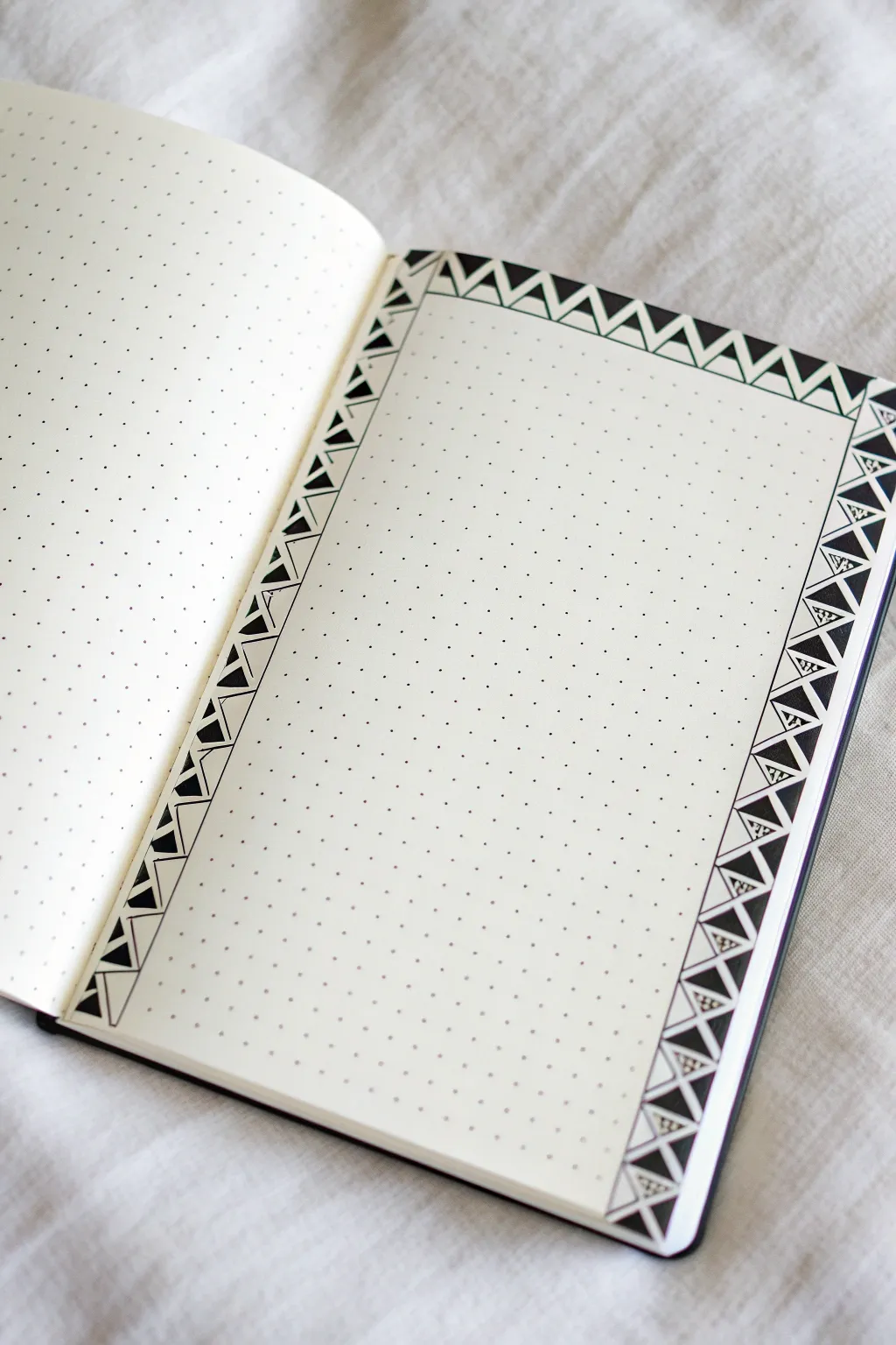 Crisp geometric triangle border for sleek bullet journal pages, alternating fill and outline.