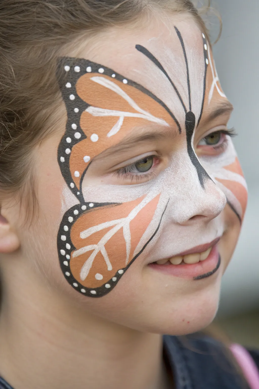 Minimal negative space butterfly face paint with crisp lines and clean skin windows for modern contrast