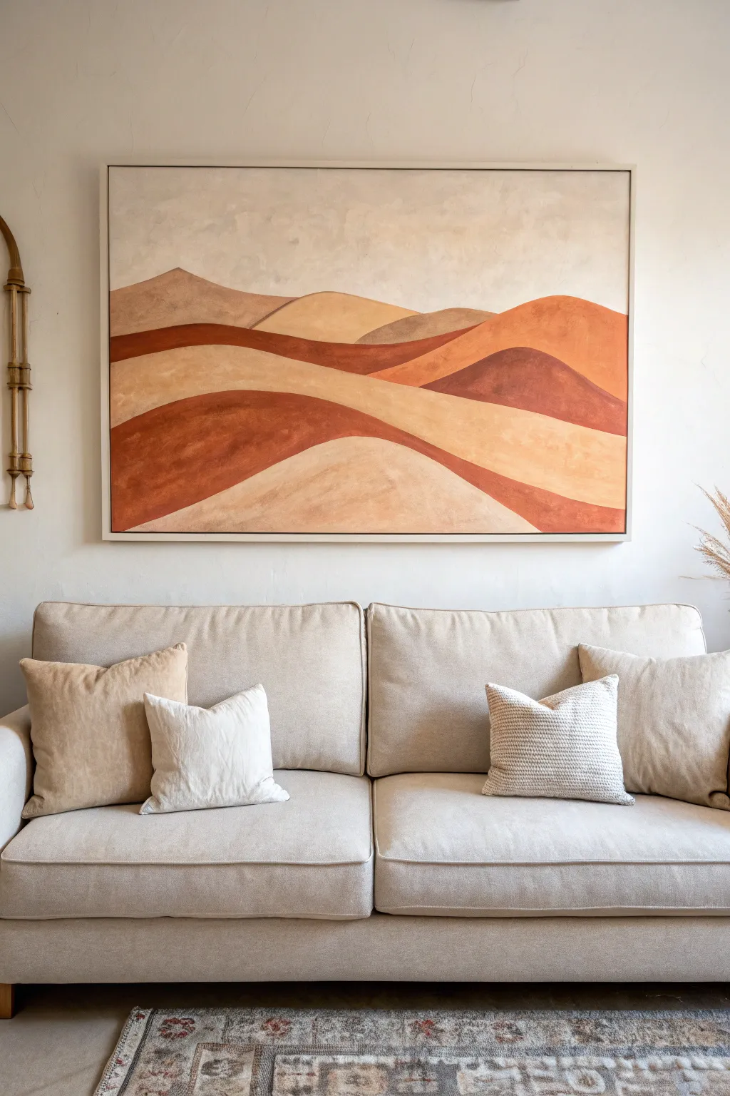 Earthy desert arches on canvas above the sofa for a calm modern organic living room moment