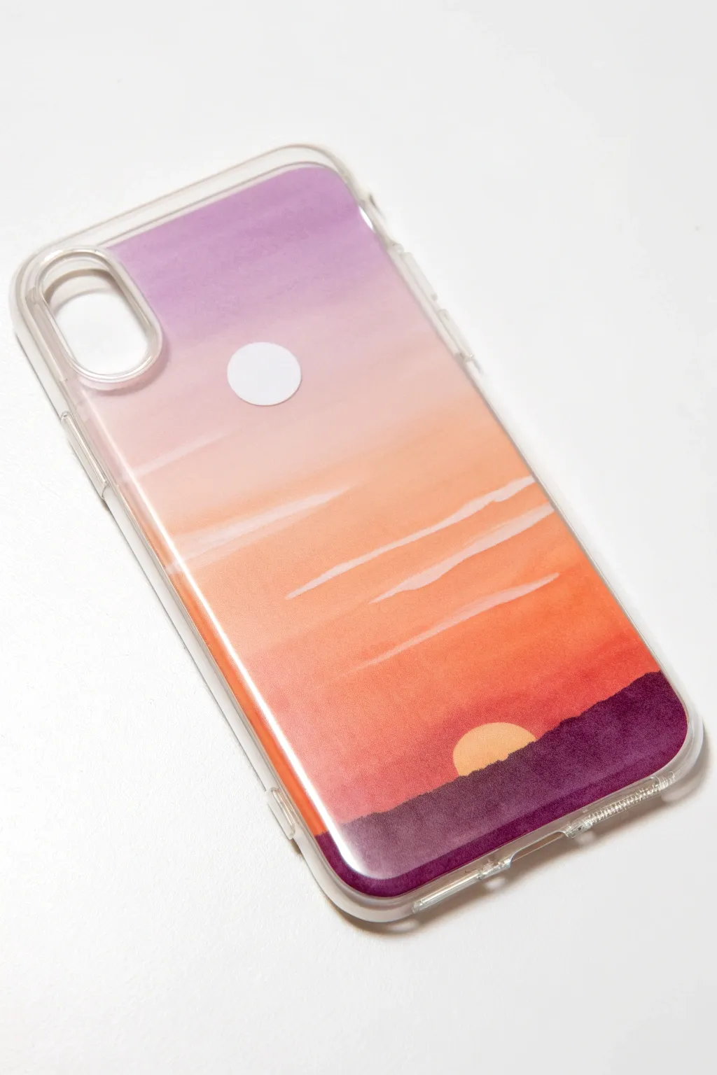 Reverse-painted gradient sunset on a clear phone case with a simple sun and soft handmade blend