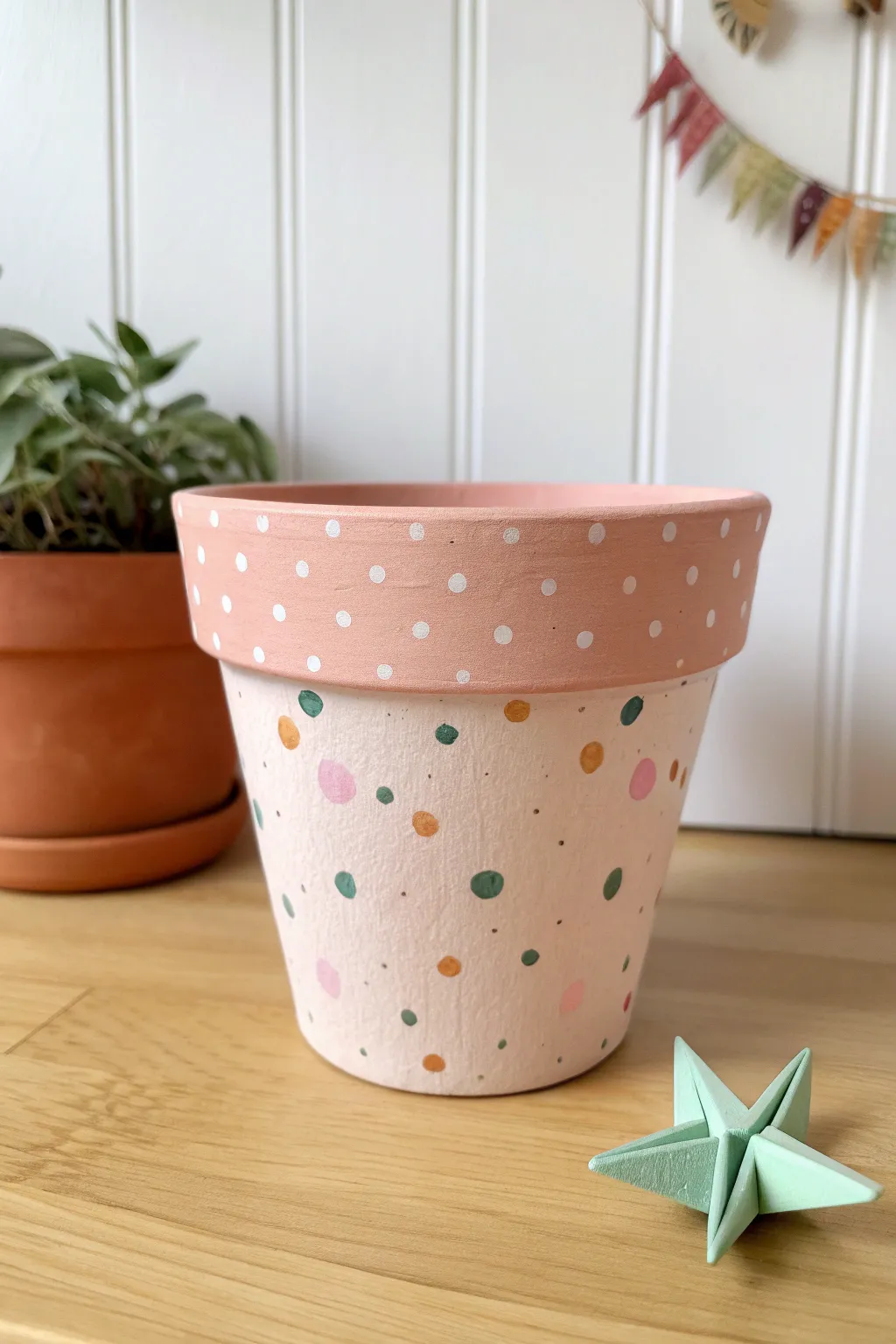 Playful confetti polka dots on a soft pastel pot for an easy, party-ready DIY at home.