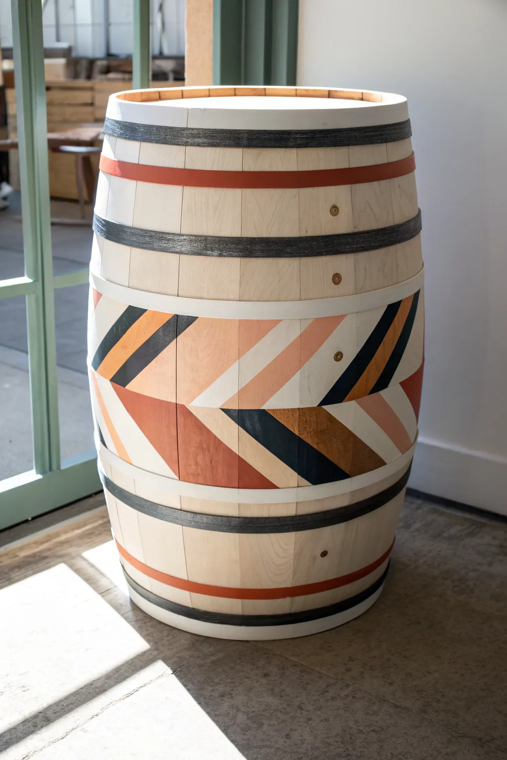 Bold geometric bands turn a simple barrel into modern Scandinavian-boho decor with crisp contrast
