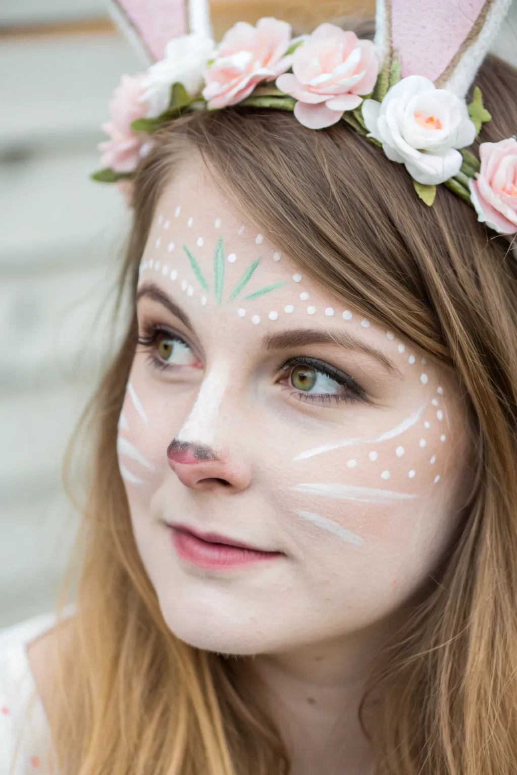 Sweet bunny crown face paint with pastel florals, minimalist boho vibe for Easter parties