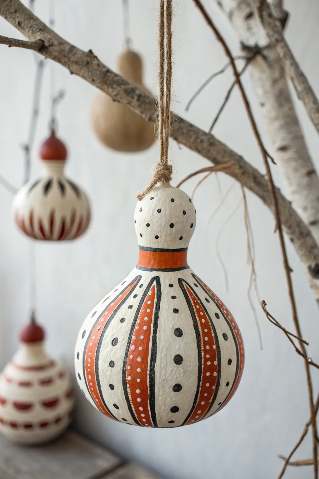 Simple striped and dotted gourd ornaments for effortless boho fall decor, minimalist style