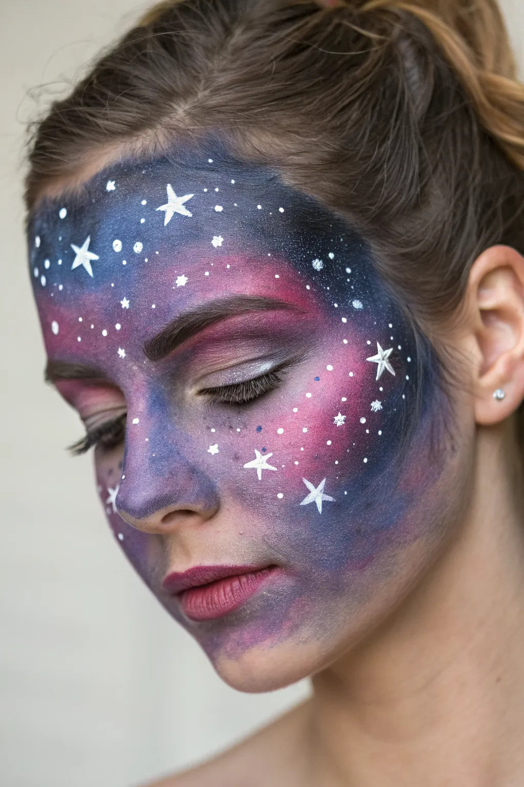 Galaxy nebula face wash in deep purples and blues, finished with glowing white star highlights